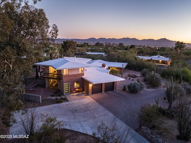 1115 W Santo Domingo Cir, Tucson, AZ 85704 - view of front of home with a mountain view, driveway, and an attached garage