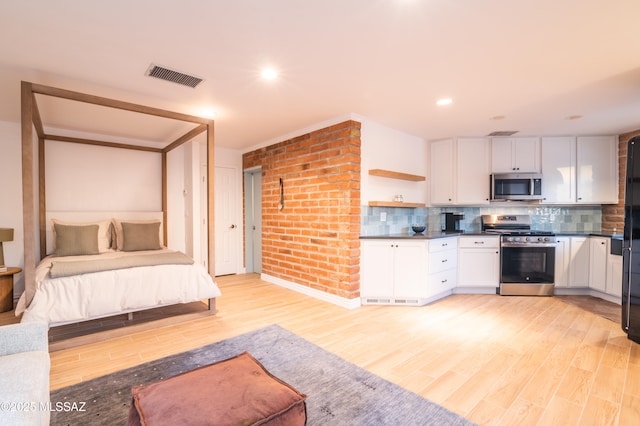1115 W Santo Domingo Cir, Tucson, AZ 85704 - bedroom with light wood-style floors and recessed lighting