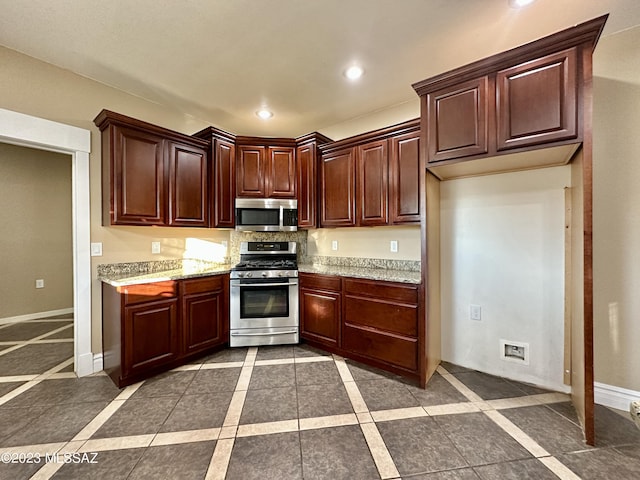 508 N Eagle Meadow Loop, Thatcher, AZ 85552 - kitchen with stainless steel appliances, recessed lighting, light stone countertops, and inlaid floor details