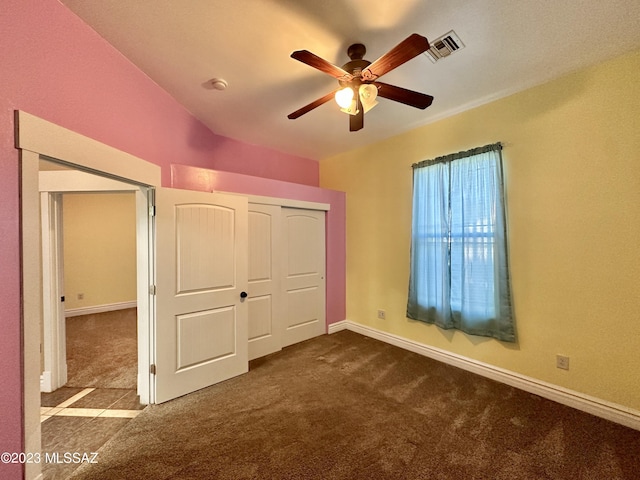 508 N Eagle Meadow Loop, Thatcher, AZ 85552 - unfurnished bedroom with dark carpet, a closet, vaulted ceiling, and ceiling fan