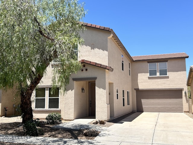 3365 N River Rapids Dr, Tucson, AZ 85712 - view of front of house with an attached garage, concrete driveway, and stucco siding