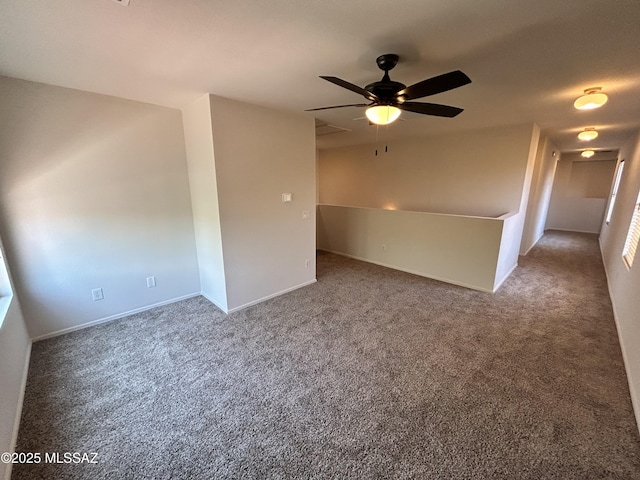 3365 N River Rapids Dr, Tucson, AZ 85712 - carpeted spare room featuring a ceiling fan and baseboards