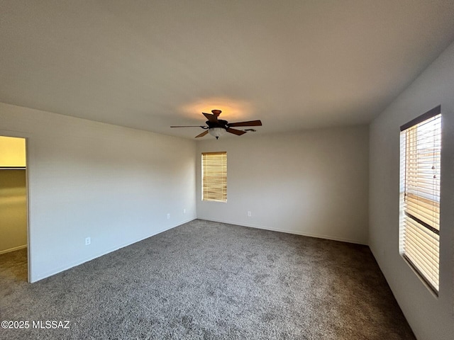 3365 N River Rapids Dr, Tucson, AZ 85712 - unfurnished room with dark colored carpet and ceiling fan