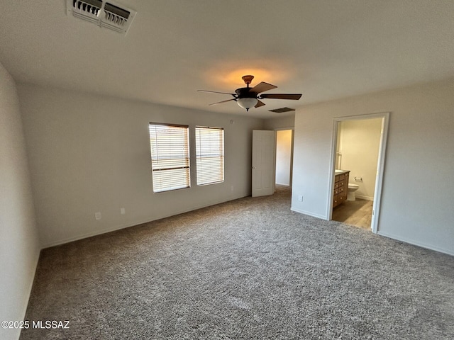 3365 N River Rapids Dr, Tucson, AZ 85712 - unfurnished bedroom with carpet flooring, ensuite bathroom, and ceiling fan