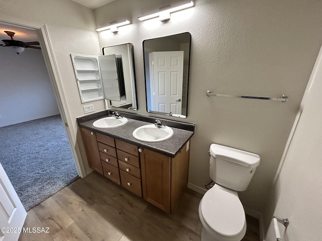 3365 N River Rapids Dr, Tucson, AZ 85712 - full bathroom with ceiling fan, double vanity, and wood finished floors