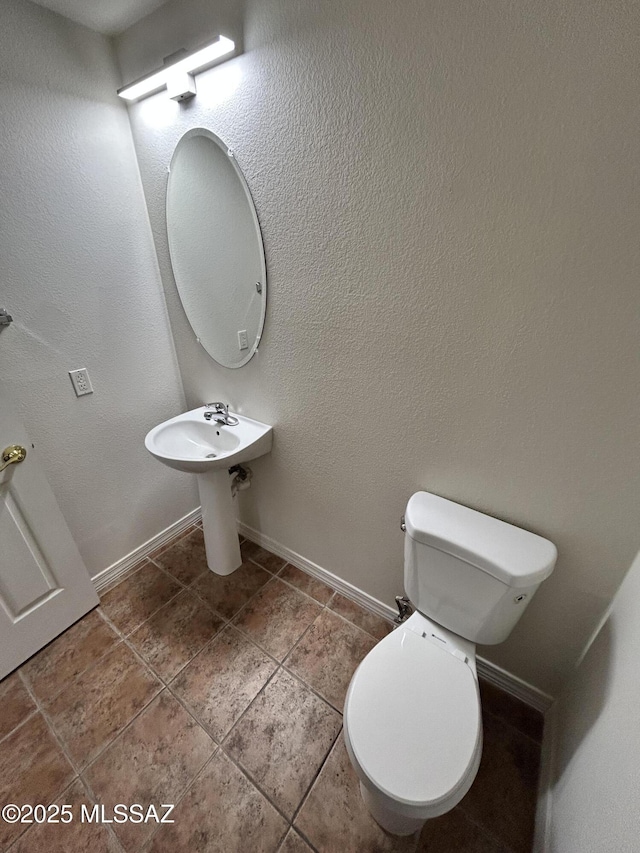 3365 N River Rapids Dr, Tucson, AZ 85712 - bathroom with toilet and tile patterned floors