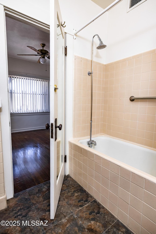 1809 E 8th St, Tucson, AZ 85719 - bathroom featuring a ceiling fan and tiled shower / bath combo