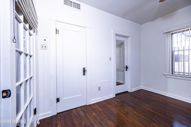 1809 E 8th St, Tucson, AZ 85719 - unfurnished bedroom with wood finished floors and baseboards