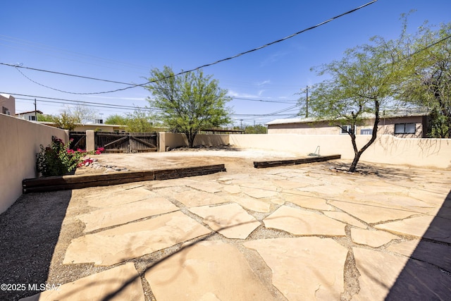 1809 E 8th St, Tucson, AZ 85719 - fenced backyard featuring a patio