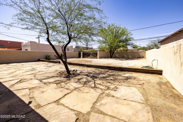 1809 E 8th St, Tucson, AZ 85719 - fenced backyard with a patio