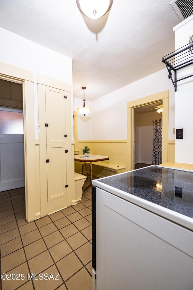 1809 E 8th St, Tucson, AZ 85719 - kitchen with tile patterned floors and dark countertops