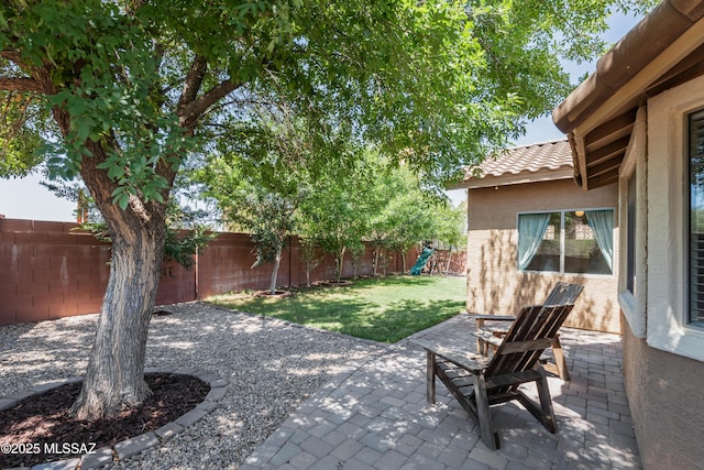 1026 E Madera Estates Ln, Sahuarita, AZ 85629 - fenced backyard featuring a patio area and a playground