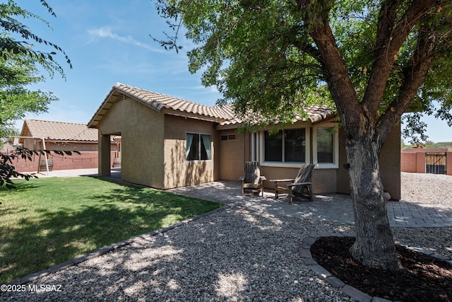 1026 E Madera Estates Ln, Sahuarita, AZ 85629 - back of property with stucco siding, a tile roof, and a patio