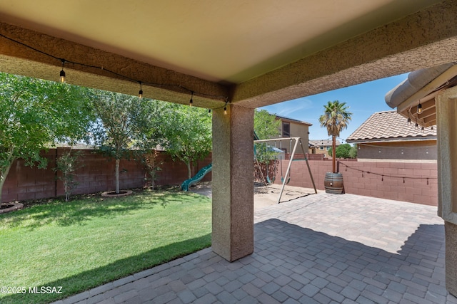 1026 E Madera Estates Ln, Sahuarita, AZ 85629 - fenced backyard with a playground and a patio area