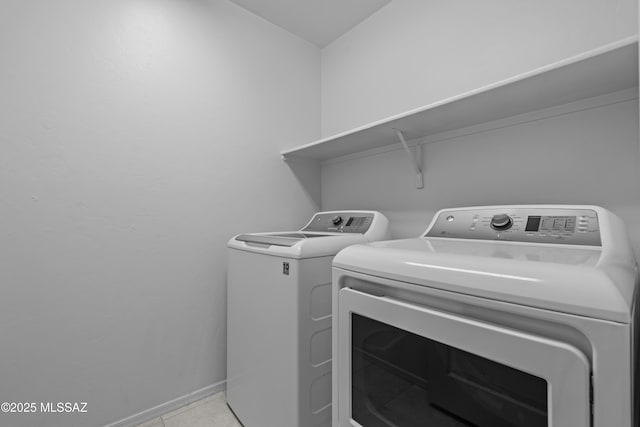 1026 E Madera Estates Ln, Sahuarita, AZ 85629 - washroom featuring separate washer and dryer and baseboards