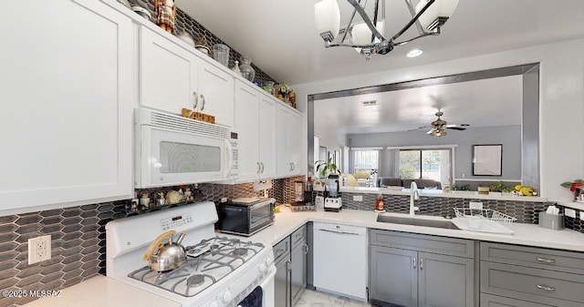 15769 S Via Cayetano, Sahuarita, AZ 85629 - kitchen featuring white appliances, gray cabinetry, backsplash, and light countertops