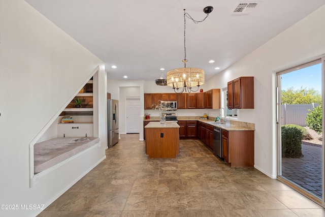 33822 S Miner Rd, Red Rock, AZ 85145 - kitchen with stainless steel appliances, a kitchen island, a chandelier, recessed lighting, and decorative light fixtures