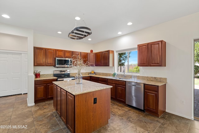 33822 S Miner Rd, Red Rock, AZ 85145 - kitchen with stainless steel appliances, plenty of natural light, recessed lighting, a kitchen island, and light stone counters