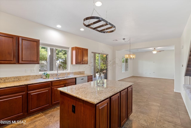 33822 S Miner Rd, Red Rock, AZ 85145 - kitchen with white dishwasher, plenty of natural light, light stone countertops, a kitchen island, and recessed lighting