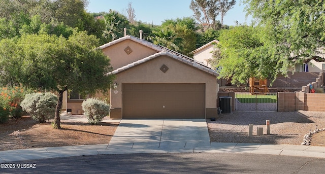2898 W Simplicity Dr, Tucson, AZ 85741 - view of front of property featuring concrete driveway, stucco siding, and a garage