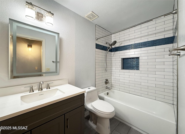 2898 W Simplicity Dr, Tucson, AZ 85741 - full bathroom featuring vanity, a textured wall, and tub / shower combination