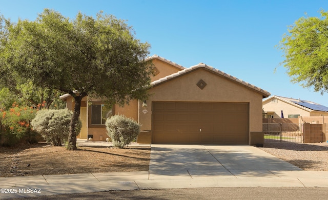 2898 W Simplicity Dr, Tucson, AZ 85741 - view of front of home with a garage, stucco siding, concrete driveway, and a tiled roof