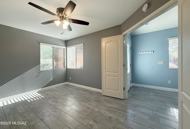 2898 W Simplicity Dr, Tucson, AZ 85741 - unfurnished room with ceiling fan, wood finish floors, and a smoke detector