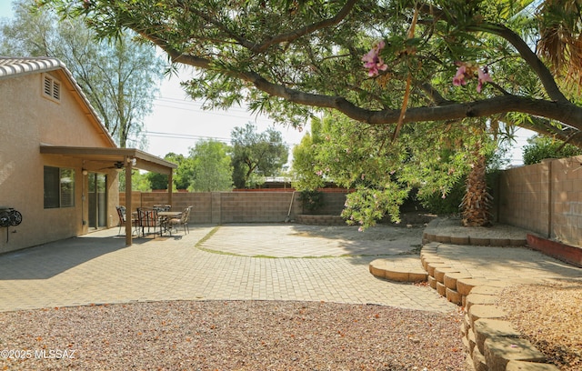2898 W Simplicity Dr, Tucson, AZ 85741 - fenced backyard featuring a patio area