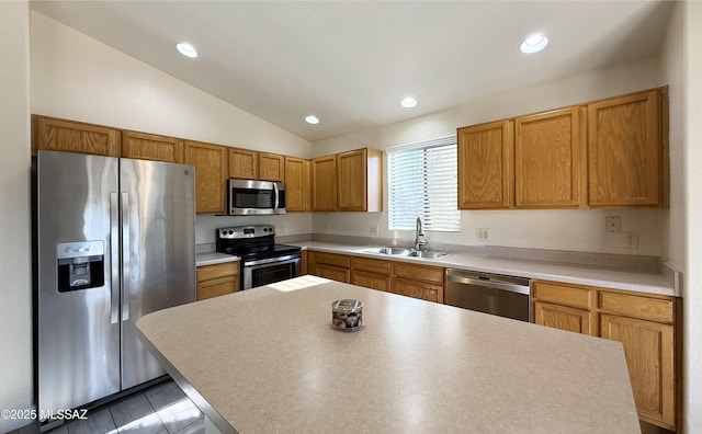 2898 W Simplicity Dr, Tucson, AZ 85741 - kitchen featuring stainless steel appliances, lofted ceiling, recessed lighting, a kitchen island, and light countertops