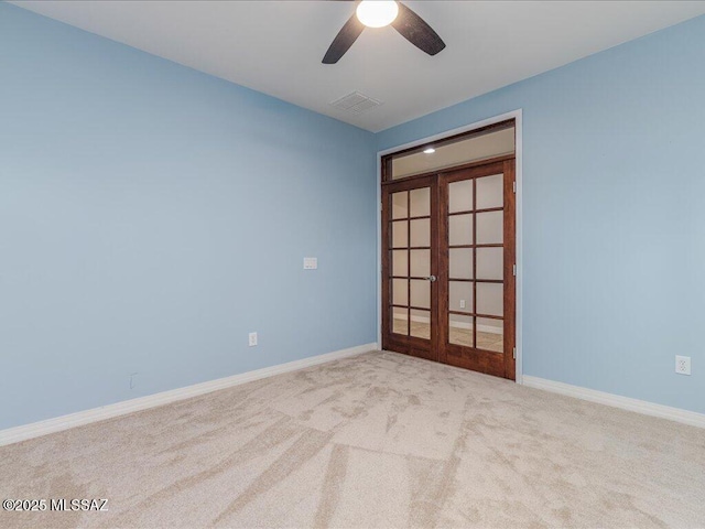 3872 W Sonoma Ranch Pl, Marana, AZ 85658 - empty room featuring french doors, carpet, and a ceiling fan