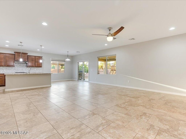 3872 W Sonoma Ranch Pl, Marana, AZ 85658 - unfurnished living room featuring recessed lighting and a ceiling fan