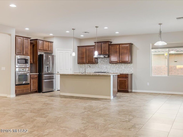 3872 W Sonoma Ranch Pl, Marana, AZ 85658 - kitchen with appliances with stainless steel finishes, backsplash, pendant lighting, recessed lighting, and under cabinet range hood