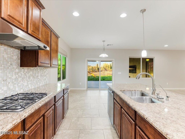 3872 W Sonoma Ranch Pl, Marana, AZ 85658 - kitchen with stainless steel appliances, ventilation hood, tasteful backsplash, decorative light fixtures, and light stone countertops