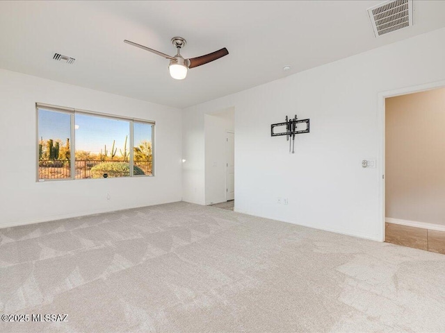 3872 W Sonoma Ranch Pl, Marana, AZ 85658 - spare room featuring a ceiling fan and light colored carpet