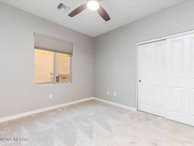 3872 W Sonoma Ranch Pl, Marana, AZ 85658 - unfurnished bedroom with carpet, a closet, and a ceiling fan