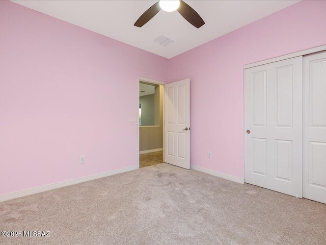 3872 W Sonoma Ranch Pl, Marana, AZ 85658 - unfurnished bedroom with carpet flooring, a closet, and ceiling fan