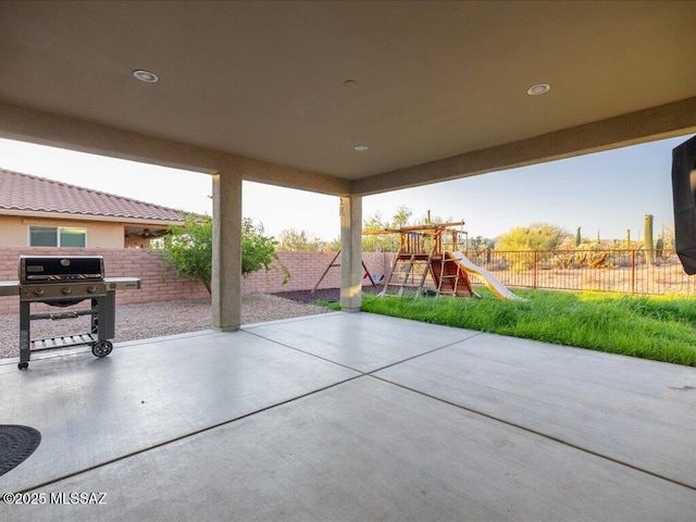 3872 W Sonoma Ranch Pl, Marana, AZ 85658 - fenced backyard featuring a playground, a patio, and a grill