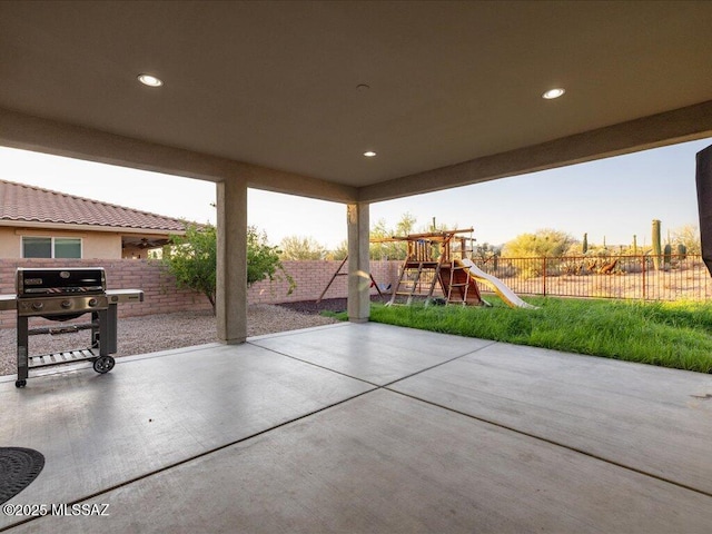 3872 W Sonoma Ranch Pl, Marana, AZ 85658 - fenced backyard with a playground, a patio, and grilling area
