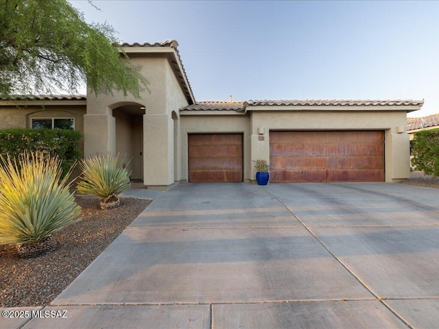 3872 W Sonoma Ranch Pl, Marana, AZ 85658 - mediterranean / spanish-style home with a garage and stucco siding