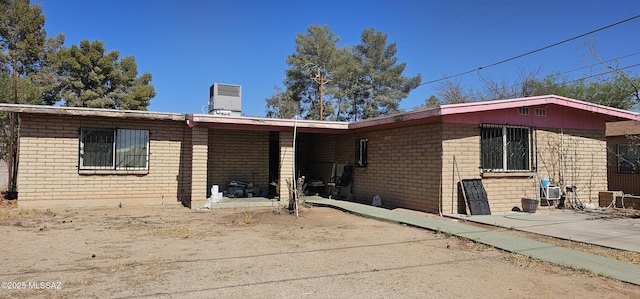 2009 S Longfellow Pl, Tucson, AZ 85711 - rear view of property with brick siding