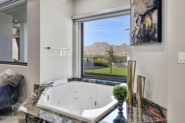 379 Camino A Las Casitas, Rio Rico, AZ 85648 - full bathroom with a mountain view and a tub with jets