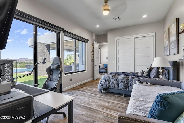 379 Camino A Las Casitas, Rio Rico, AZ 85648 - bedroom featuring wood finished floors, access to exterior, a closet, recessed lighting, and ceiling fan