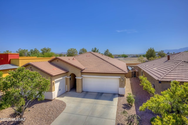 8348 N Mountain Stone Pine Way, Tucson, AZ 85743 - single story home featuring an attached garage, stucco siding, a tiled roof, and driveway