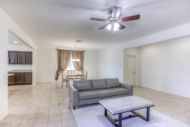 8348 N Mountain Stone Pine Way, Tucson, AZ 85743 - living area featuring light tile patterned floors, ceiling fan, and a chandelier