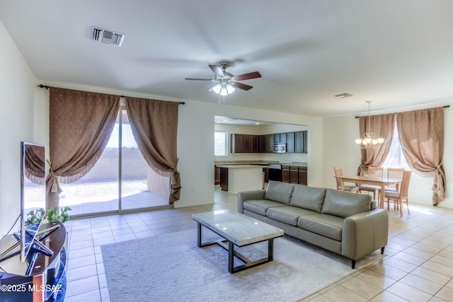 8348 N Mountain Stone Pine Way, Tucson, AZ 85743 - living room featuring ceiling fan, a chandelier, and light tile patterned floors