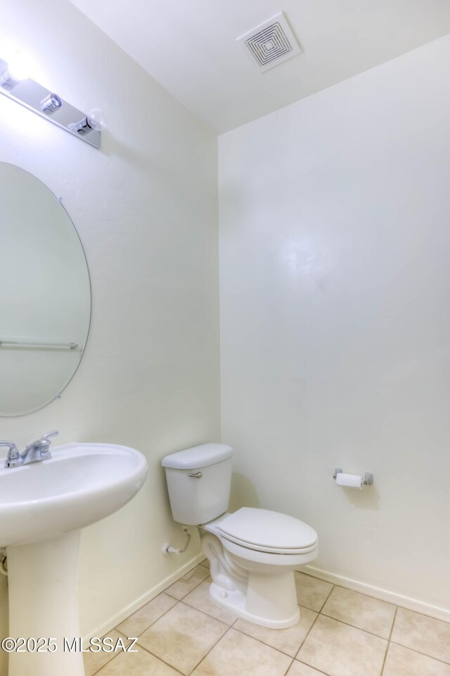 8348 N Mountain Stone Pine Way, Tucson, AZ 85743 - half bathroom with tile patterned floors