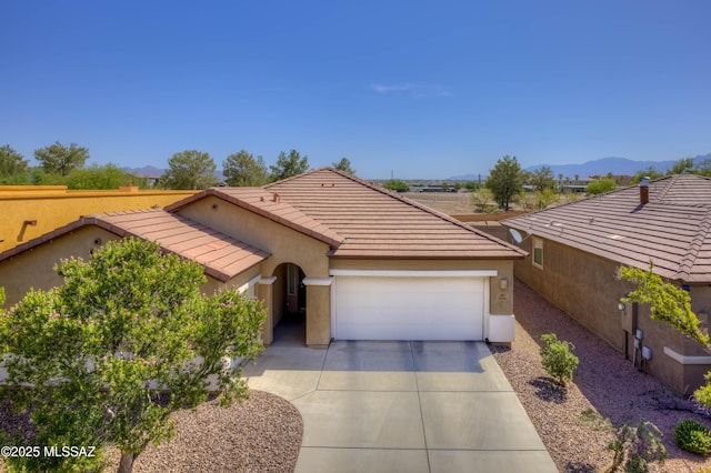 8348 N Mountain Stone Pine Way, Tucson, AZ 85743 - ranch-style home featuring stucco siding, a garage, concrete driveway, a tile roof, and a mountain view