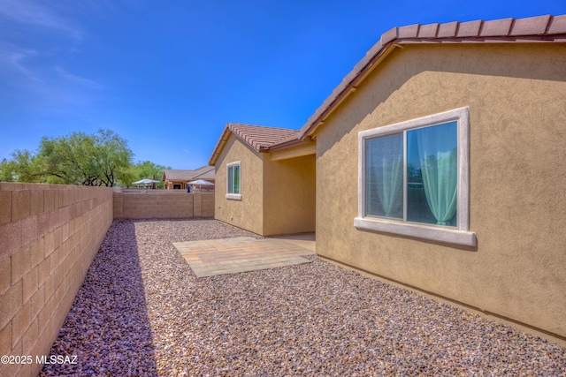 8348 N Mountain Stone Pine Way, Tucson, AZ 85743 - fenced backyard with a patio area