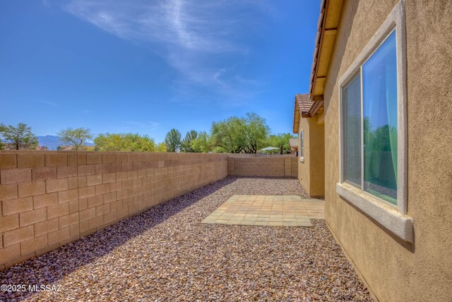 8348 N Mountain Stone Pine Way, Tucson, AZ 85743 - fenced backyard featuring a patio