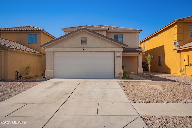 3969 E Agate Knoll Dr, Tucson, AZ 85756 - traditional-style house with stucco siding, driveway, an attached garage, and a tiled roof